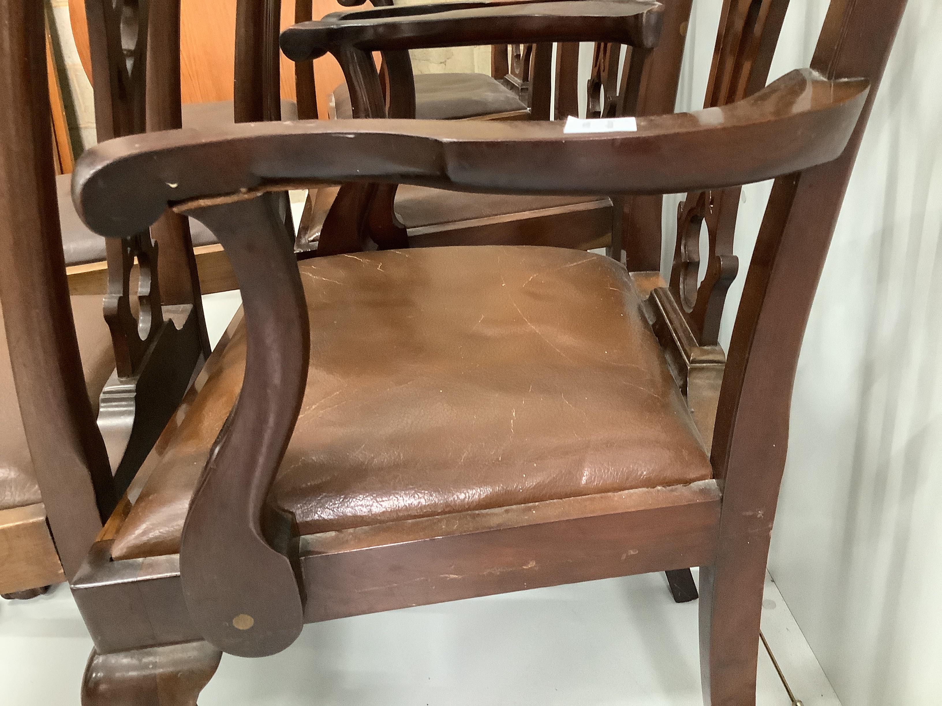 A set of six Chippendale style mahogany dining chairs, two with arms